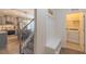 Open-concept kitchen with gray cabinets, stainless steel appliances, and a view into the dining area at 71 Sandy Farm Ct, Willow Springs, NC 27592