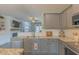 Spacious kitchen featuring granite counters, stainless appliances, and an open floor plan at 71 Sandy Farm Ct, Willow Springs, NC 27592