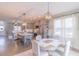 Open kitchen and dining area features stainless steel appliances and a cozy dining space at 71 Sandy Farm Ct, Willow Springs, NC 27592