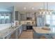 Well-equipped kitchen featuring stainless steel appliances, granite countertops, and an island with barstool seating at 71 Sandy Farm Ct, Willow Springs, NC 27592
