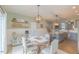 View of the kitchen and dining area showing open floor plan and hardwood floors at 71 Sandy Farm Ct, Willow Springs, NC 27592