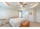 Comfortable main bedroom featuring a tray ceiling, carpeted floors, and lots of natural light at 71 Sandy Farm Ct, Willow Springs, NC 27592