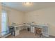 Bright home office featuring ample desk space, natural light, and storage solutions at 71 Sandy Farm Ct, Willow Springs, NC 27592