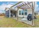 Backyard with pergola, grill, screened-in porch, and patio at 7584 Oakberry Dr, Raleigh, NC 27616