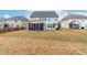 Large backyard with patio, pergola, and screened-in porch at 7584 Oakberry Dr, Raleigh, NC 27616