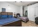 Cozy bedroom featuring two beds, tile flooring, and closet access at 7584 Oakberry Dr, Raleigh, NC 27616