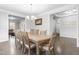 Formal dining room with large table, chandelier, and access to living areas, perfect for gatherings at 7584 Oakberry Dr, Raleigh, NC 27616