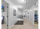Bright and airy upstairs hallway with carpet floors leads to multiple rooms, offering easy access throughout the home at 7584 Oakberry Dr, Raleigh, NC 27616