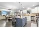 Open kitchen seamlessly connected to the dining and living areas, featuring a stylish center island at 7584 Oakberry Dr, Raleigh, NC 27616