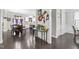 Open-concept living space with modern decor featuring a kitchen, dining area, and bar, perfect for entertaining at 7584 Oakberry Dr, Raleigh, NC 27616