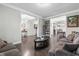 Spacious living room with hardwood floors, open doorways, and plenty of room for entertaining guests at 7584 Oakberry Dr, Raleigh, NC 27616