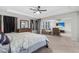 Spacious Primary suite featuring an open-concept design with a comfortable seating area and TV at 7584 Oakberry Dr, Raleigh, NC 27616