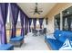 Relaxing screened-in patio with comfortable seating and ceiling fan at 7584 Oakberry Dr, Raleigh, NC 27616