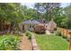 Aerial view of backyard with patio, lawn and garden at 800 E Forest Hills Blvd, Durham, NC 27707