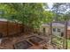 Spacious backyard featuring mature trees, a garden and landscaping at 800 E Forest Hills Blvd, Durham, NC 27707
