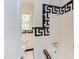 Bathroom featuring patterned tile detail on walls and tub at 800 E Forest Hills Blvd, Durham, NC 27707