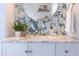 Stylish bathroom features a marble countertop, modern fixtures, and decorative wallpaper creating a chic ambiance at 800 E Forest Hills Blvd, Durham, NC 27707