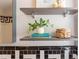 Bathroom shelves decorated with plant, books and basket at 800 E Forest Hills Blvd, Durham, NC 27707