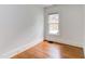 Bedroom featuring hardwood floors and single window at 800 E Forest Hills Blvd, Durham, NC 27707
