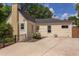 Rear view of the home featuring a patio and well-kept lawn at 800 E Forest Hills Blvd, Durham, NC 27707