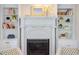 Close-up of a decorative fireplace with built-in bookshelves displaying books and decor at 800 E Forest Hills Blvd, Durham, NC 27707