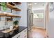 Kitchen with stainless steel appliances, hardwood floors and bright lighting at 800 E Forest Hills Blvd, Durham, NC 27707