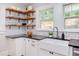 Charming kitchen features a farmhouse sink, stylish faucet and dark countertops at 800 E Forest Hills Blvd, Durham, NC 27707