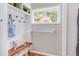 Mudroom featuring a storage bench, coat rack and integrated laundry at 800 E Forest Hills Blvd, Durham, NC 27707