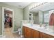 Well-lit bathroom featuring double sinks, a linen closet and a separate room for the toilet and shower at 825 Federal House Ave, Wake Forest, NC 27587