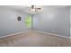 Bedroom with carpet, ceiling fan, and a window overlooking the neighborhood at 825 Federal House Ave, Wake Forest, NC 27587