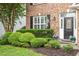 Well maintained front exterior with manicured landscaping and brick facade at 825 Federal House Ave, Wake Forest, NC 27587