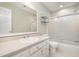 Bright bathroom featuring a white vanity, framed mirror, and a shower with glass doors at 8420 Caldbeck Dr, Raleigh, NC 27615