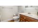 Cozy bathroom featuring a wood vanity, sleek sink, and modern fixtures at 8420 Caldbeck Dr, Raleigh, NC 27615