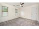 Bedroom featuring neutral carpet, white walls and ample natural light from two windows at 8420 Caldbeck Dr, Raleigh, NC 27615