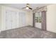 Bedroom featuring neutral carpet, white walls and double door closet at 8420 Caldbeck Dr, Raleigh, NC 27615