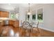 Charming breakfast nook with a glass table, surrounded by bright windows at 8420 Caldbeck Dr, Raleigh, NC 27615