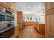 Bright kitchen featuring stainless steel appliances, granite countertops and light wood cabinetry at 8420 Caldbeck Dr, Raleigh, NC 27615