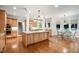 Spacious kitchen featuring stainless steel appliances, granite countertops, and a large central island at 8420 Caldbeck Dr, Raleigh, NC 27615
