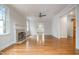 Bright living room with a fireplace and hardwood floors, offering ample space at 8420 Caldbeck Dr, Raleigh, NC 27615