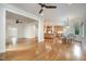 Open living space with hardwood floors connecting living, dining, and kitchen areas at 8420 Caldbeck Dr, Raleigh, NC 27615
