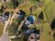 Wide aerial shot shows the home's location in a neighborhood with a pool, landscaping, and convenient access to other properties at 8709 Kimalden Ct, Wake Forest, NC 27587