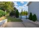Fenced backyard features a stunning pool, landscaping, and space to relax at 8709 Kimalden Ct, Wake Forest, NC 27587