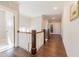 Hallway with dark wood floors, white trim, and access to rooms through paneled glass doors at 8709 Kimalden Ct, Wake Forest, NC 27587