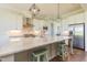 Open kitchen featuring an oversized island, stainless steel appliances, and white cabinets at 8709 Kimalden Ct, Wake Forest, NC 27587
