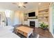 Open living room featuring a fireplace, built-in shelving, and lots of natural light at 8709 Kimalden Ct, Wake Forest, NC 27587