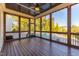 Enjoy a spacious screened porch with scenic backyard views, including the pool at 8709 Kimalden Ct, Wake Forest, NC 27587