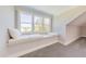 Bonus room features a cozy window seat with three windows providing plenty of natural light at 8709 Kimalden Ct, Wake Forest, NC 27587