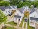 Aerial view of a neighborhood with charming homes, manicured lawns, and private driveways at 902 B Oakland Ave, Durham, NC 27705
