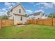 This home offers a great backyard with wooden fence, green grass and room to enjoy at 902 B Oakland Ave, Durham, NC 27705