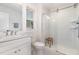 Well-lit bathroom showcasing a walk-in shower with subway tiles and a modern vanity with stone countertop at 902 B Oakland Ave, Durham, NC 27705